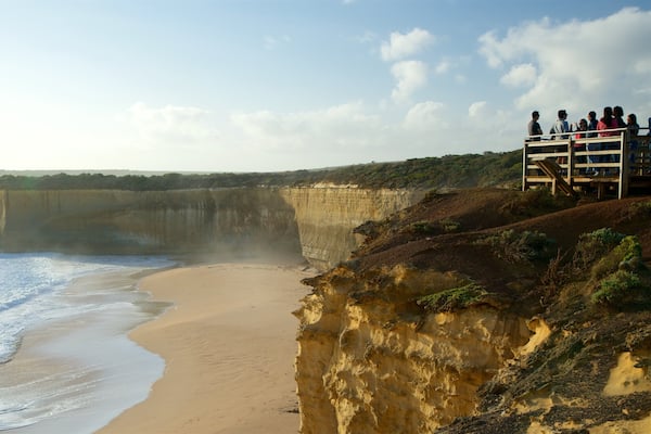 Port Campbell which includes a beach and views as well as a large group of people