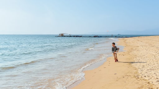 One Asian boy having fun at Xunliao Bay beach in Huizhou, Guangdong province, China, in January winter