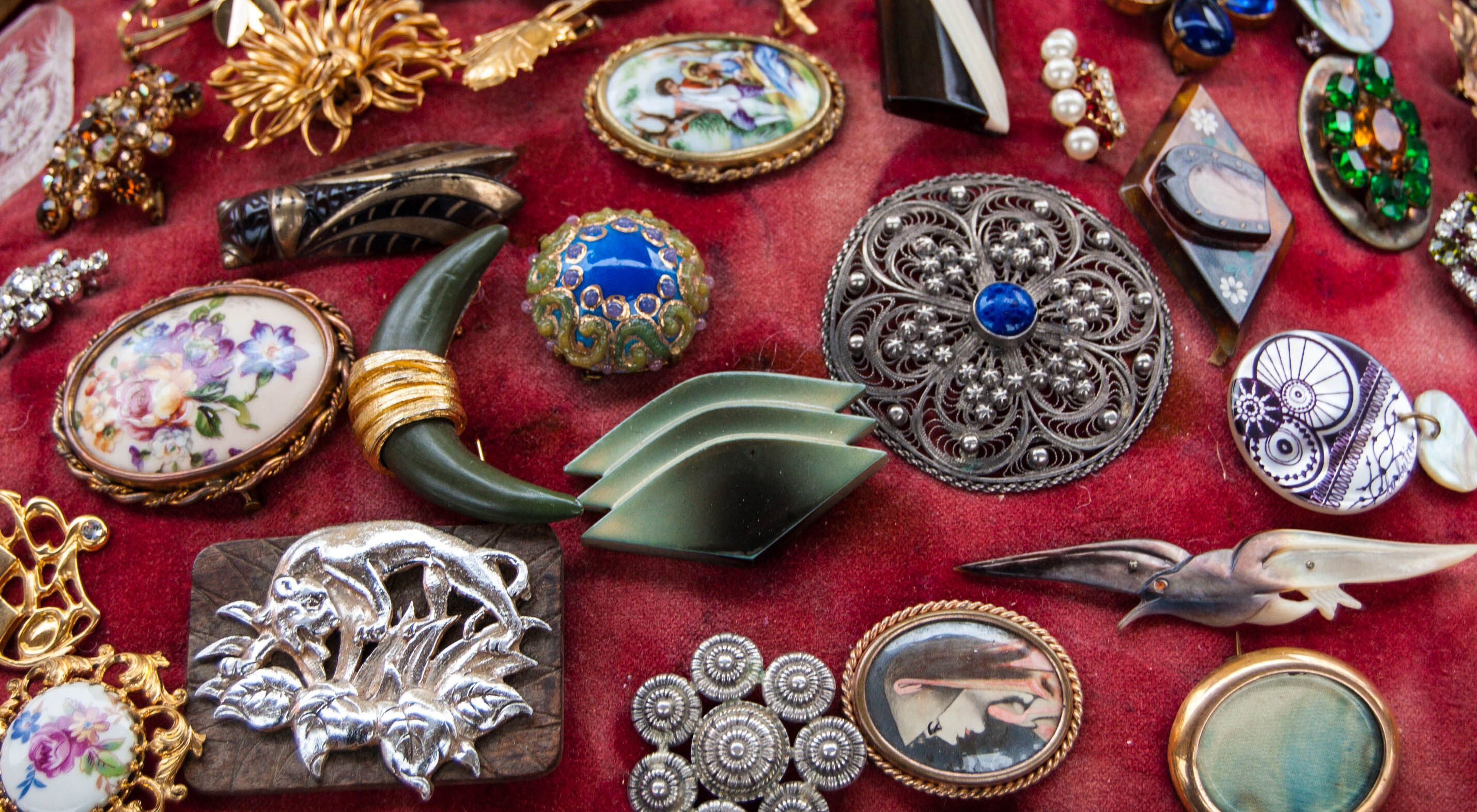 Jewelry background. Vintage brooches at flea market in Paris (France).