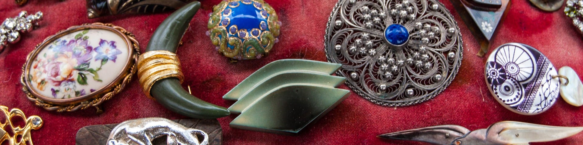 Jewelry background. Vintage brooches at flea market in Paris (France).