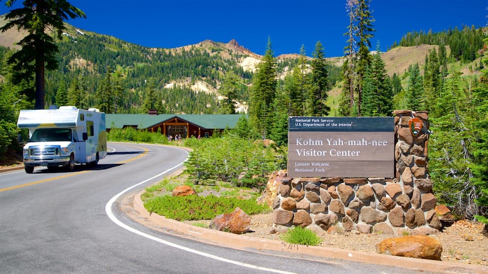 A road leading to the Kohm Yah-mah-nee Visitor Center with a camper parked nearby.