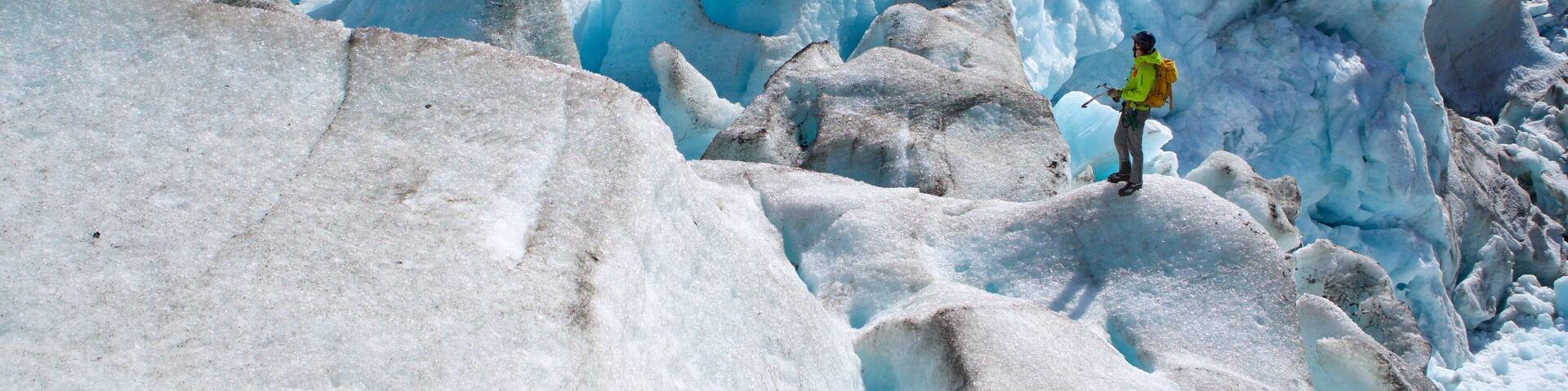 Godwin Glacier showing climbing and snow as well as an individual male