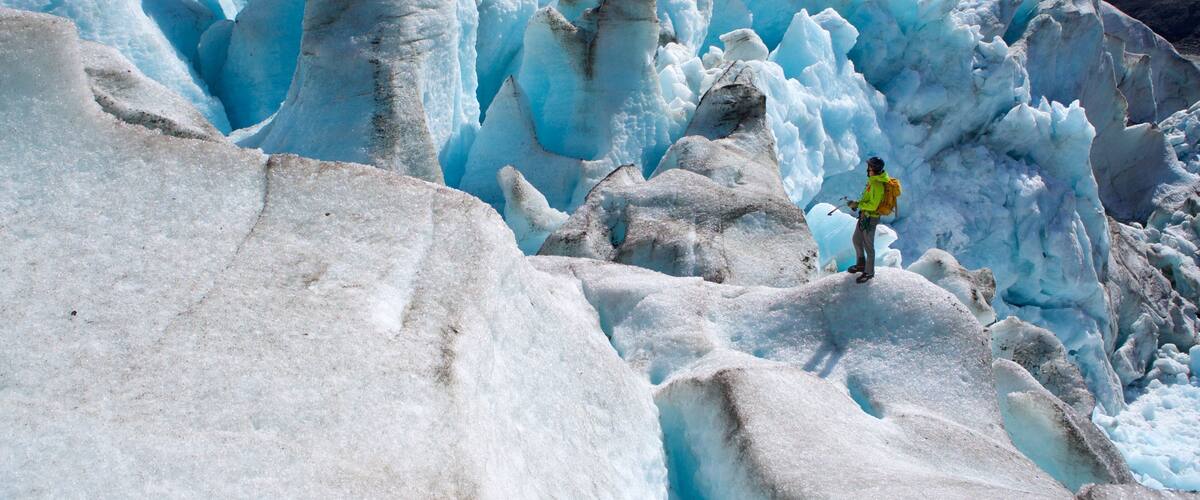 Godwin Glacier showing climbing and snow as well as an individual male