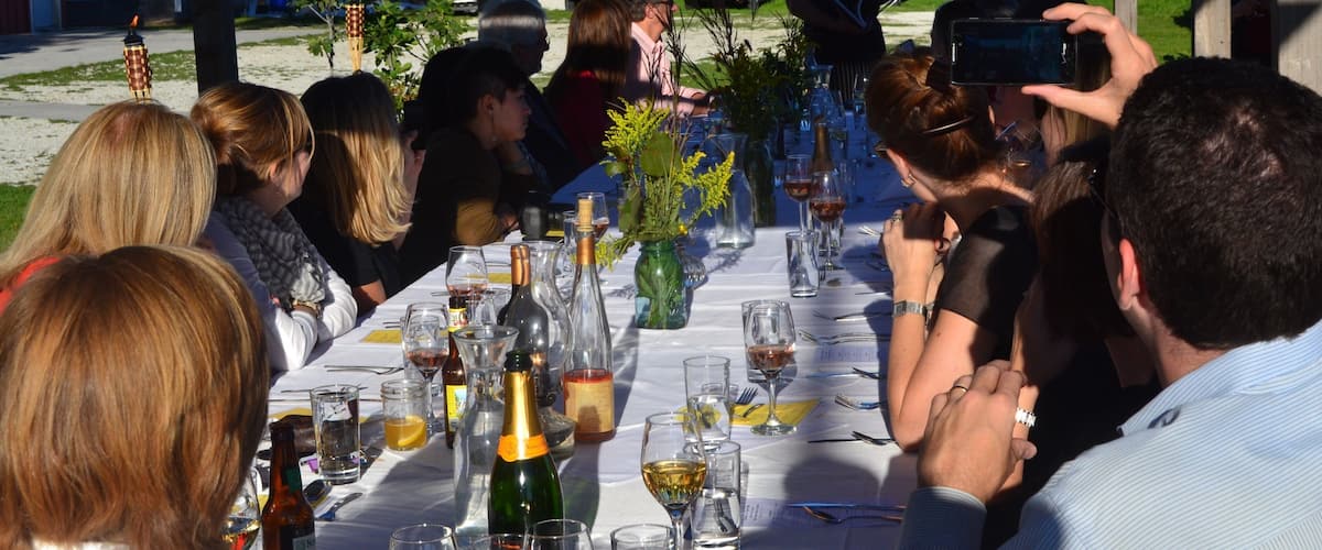 Champaign featuring outdoor eating as well as a small group of people