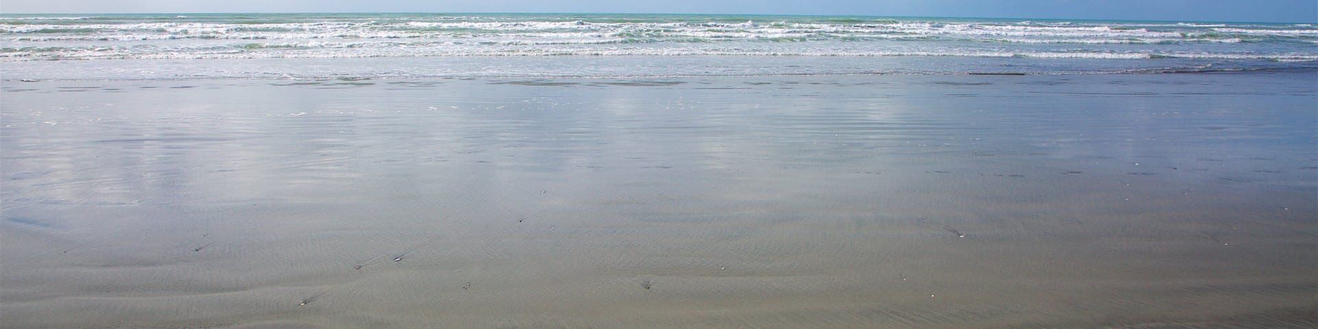 Westport showing a beach and surf