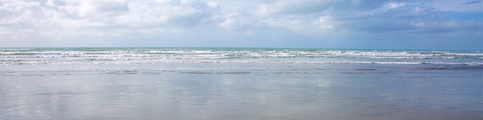 Westport showing a beach and surf