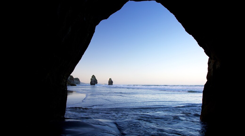 The Three Sisters which includes general coastal views and a sunset