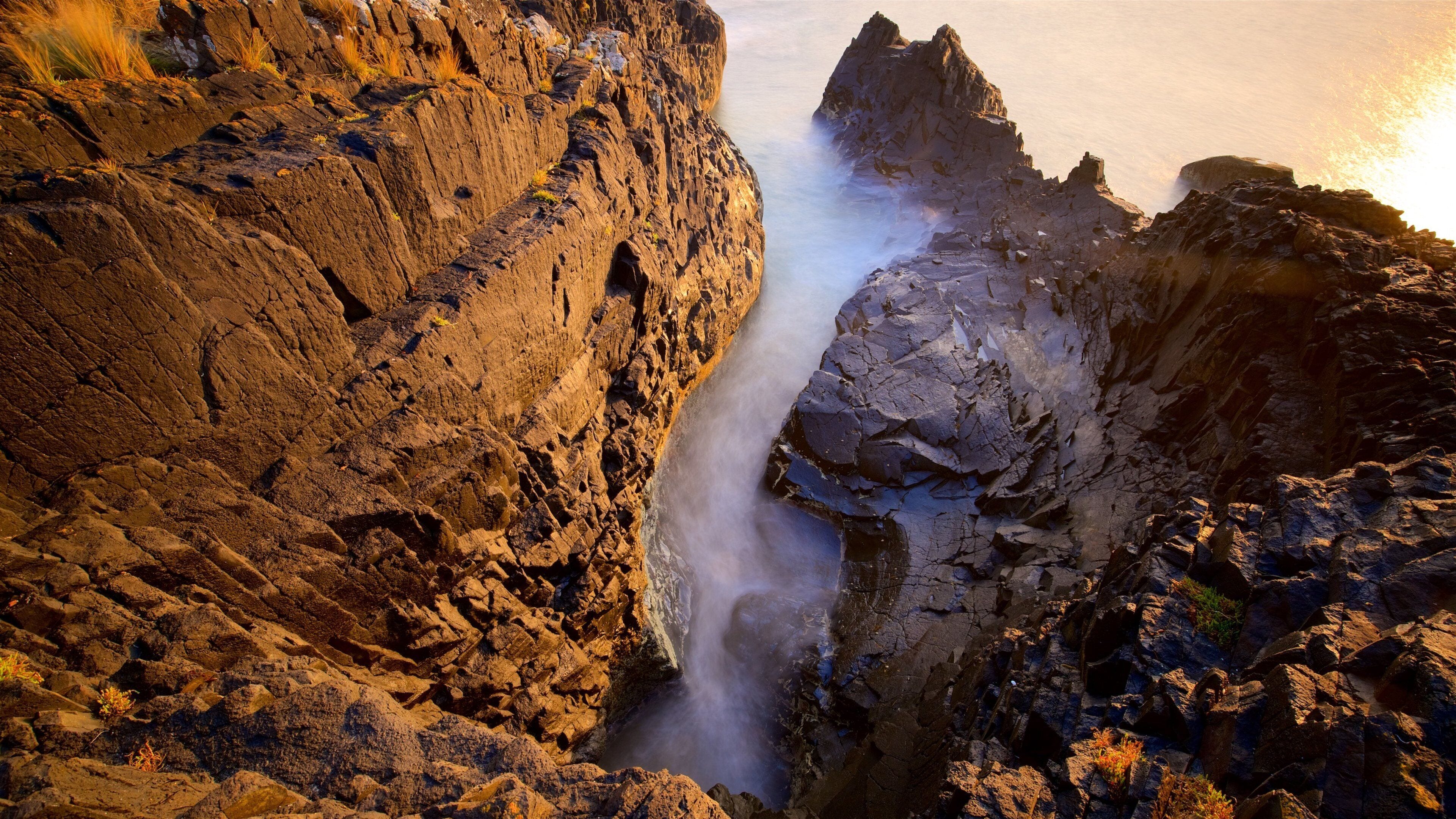Perkins Bay featuring rugged coastline, general coastal views and a sunset
