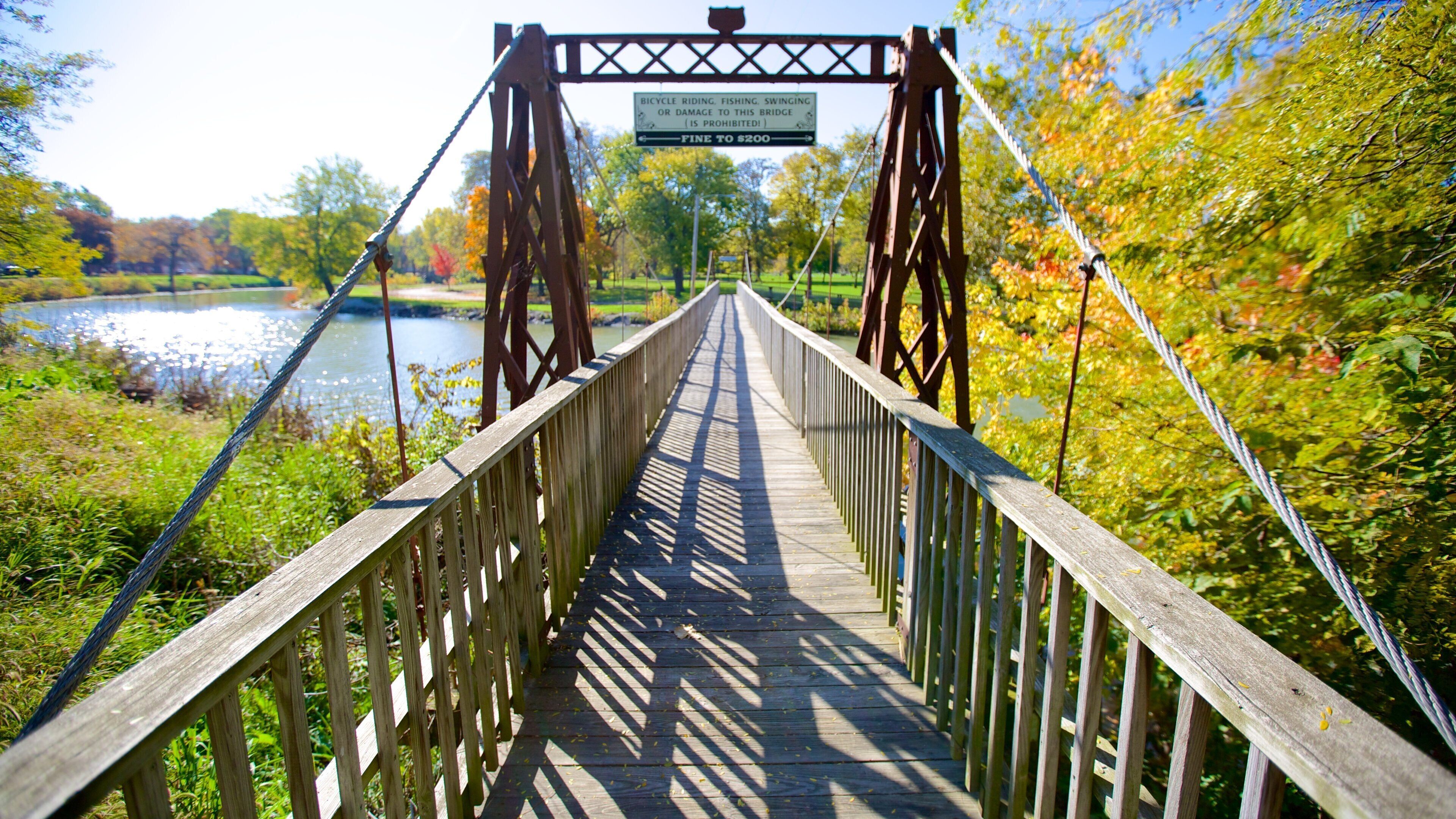 Chautauqua Park which includes a river or creek and a bridge