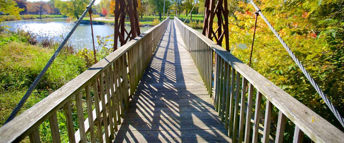 Chautauqua Park which includes a river or creek and a bridge