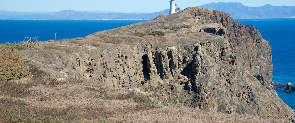 Ventura featuring rocky coastline and a lighthouse