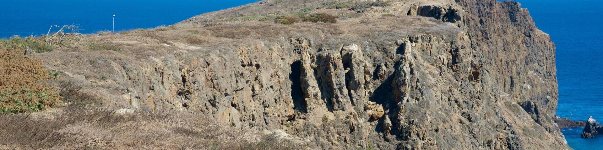 Ventura featuring rocky coastline and a lighthouse