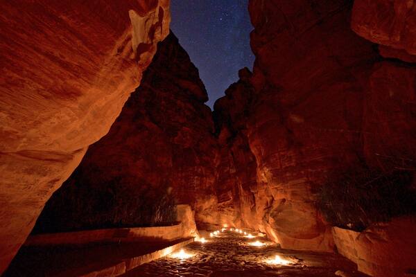 al-Siq showing a gorge or canyon and night scenes