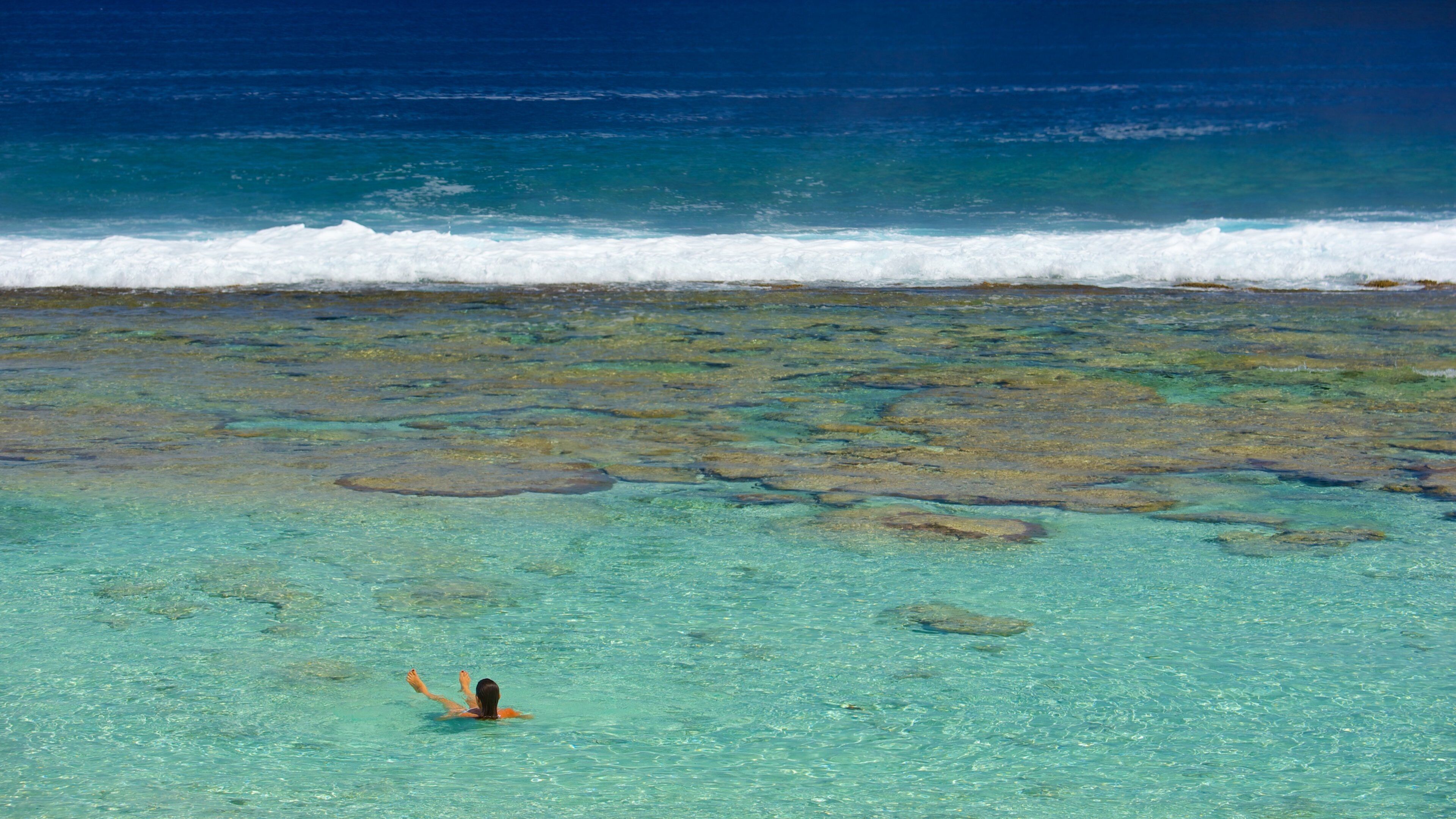 Atiu featuring tropical scenes as well as an individual femail