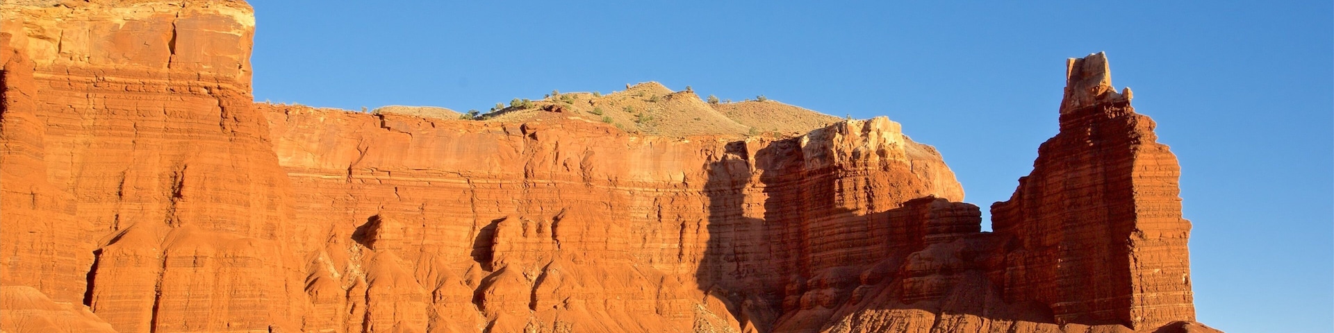 Capitol Reef National Park showing desert views, a gorge or canyon and tranquil scenes