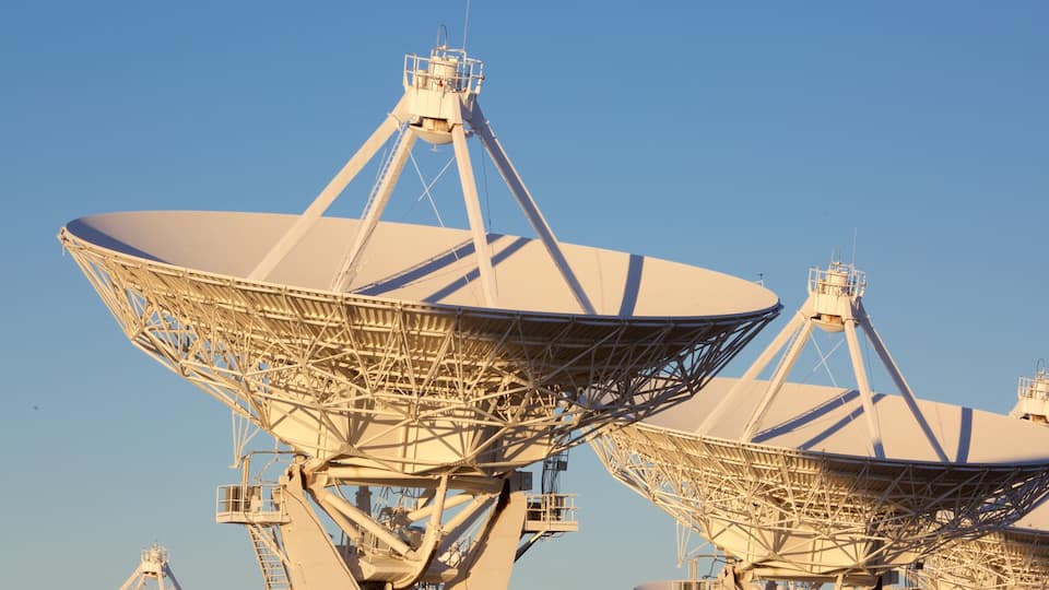 Two large satellite dishes with supporting structures.
