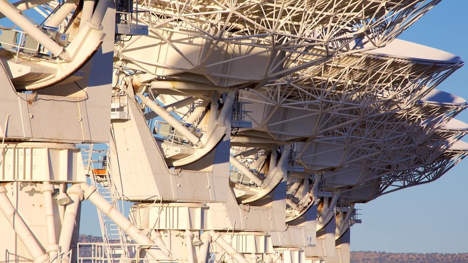 A large industrial structure with multiple satellite dishes and antennas.