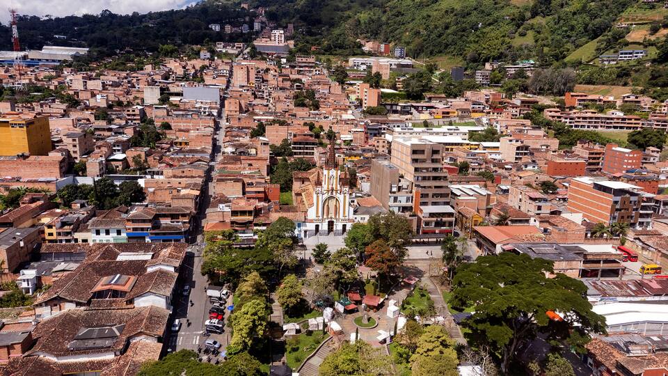 A densely packed urban area with a prominent church and surrounding residential buildings.