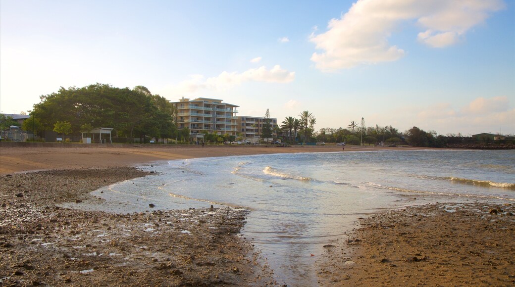 Barney Point Beach featuring a sandy beach, a coastal town and a sunset