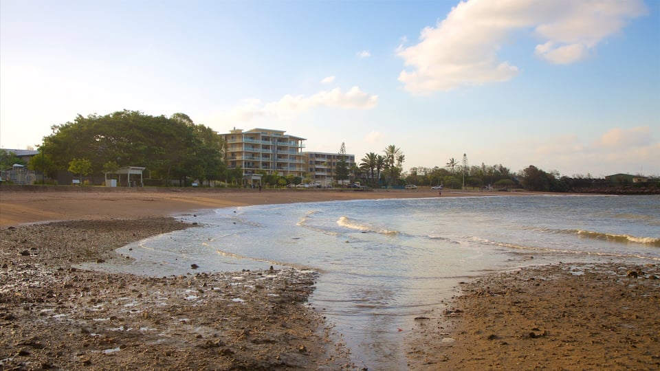 Barney Point Beach featuring a sandy beach, a coastal town and a sunset
