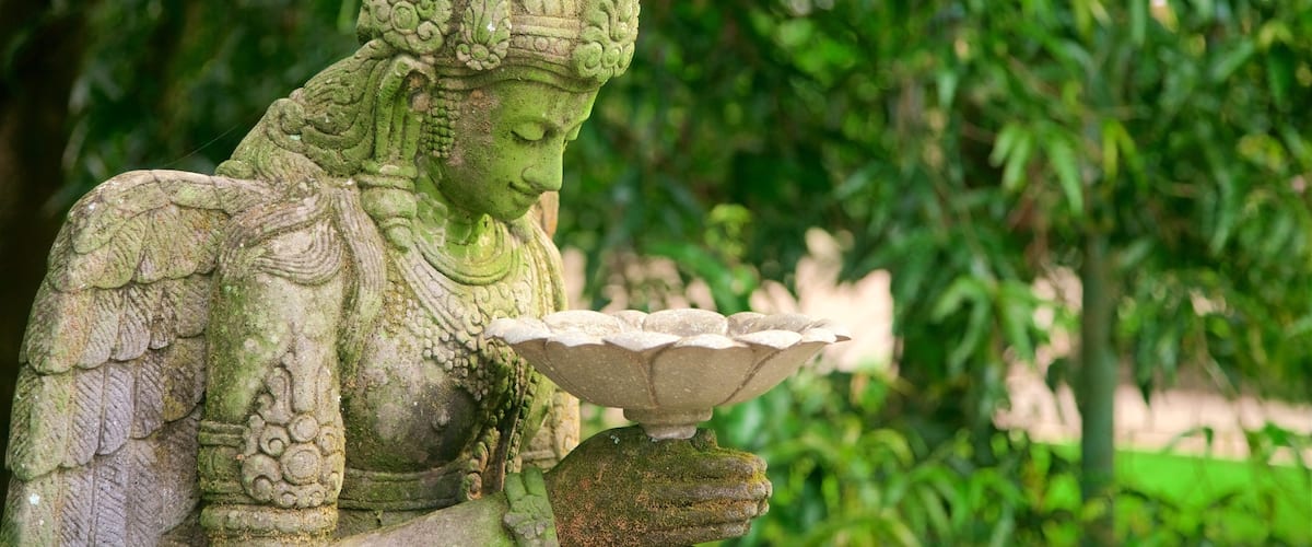 Mendut Buddhist Monastery showing heritage elements and a statue or sculpture