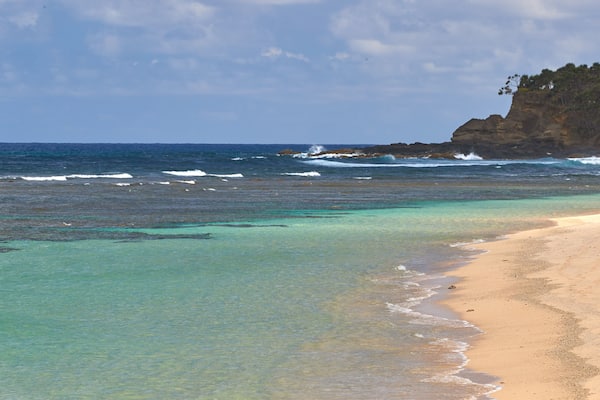 Tanna Island welches beinhaltet Sandstrand und allgemeine Küstenansicht
