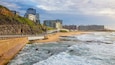 Newcastle Beach showing a coastal town and general coastal views