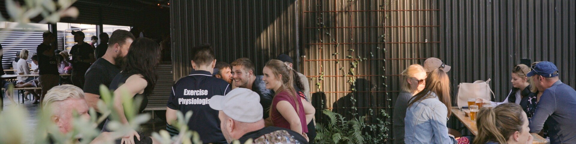 All Inn Brewing Co. featuring outdoor eating as well as a small group of people