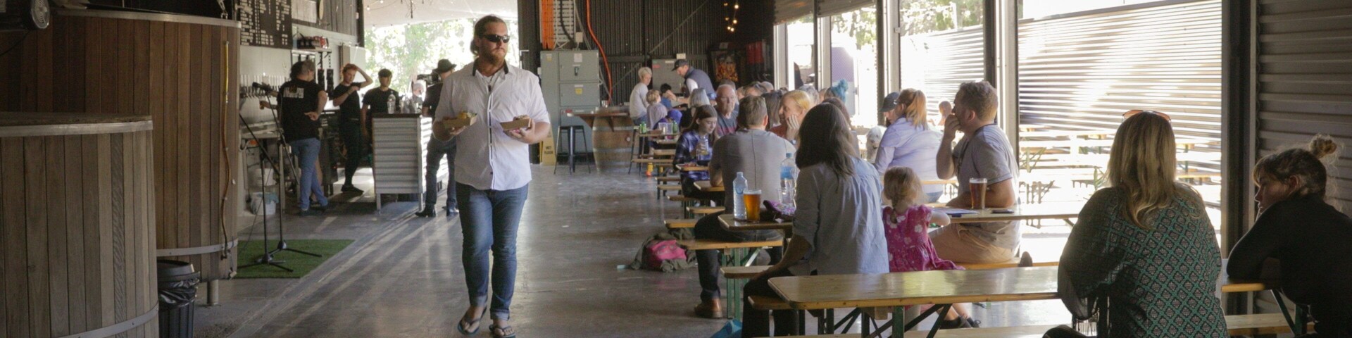 All Inn Brewing Co. which includes interior views as well as a small group of people