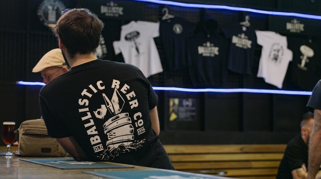 Ballistic Beer Co. showing interior views as well as an individual male