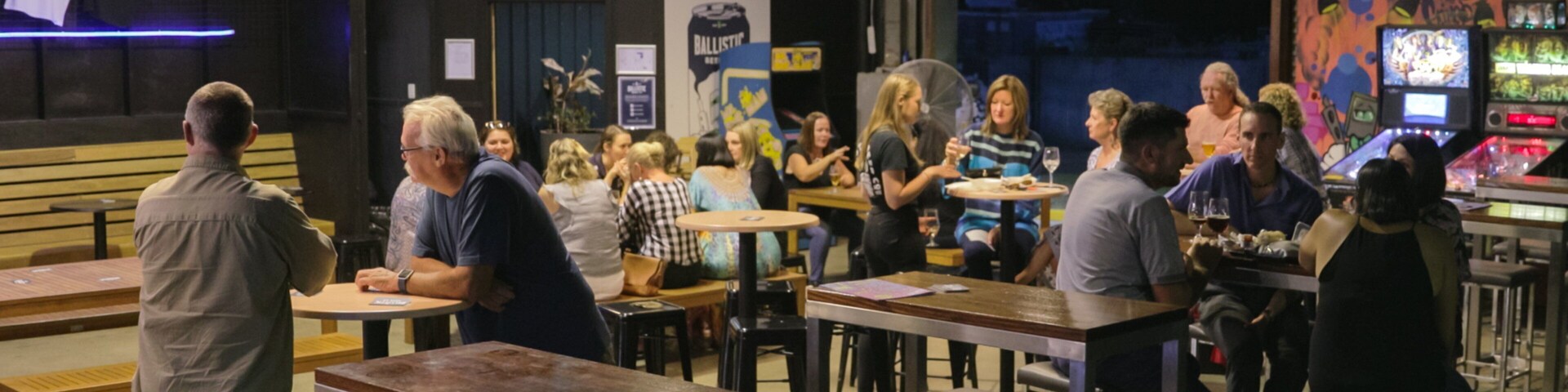 Ballistic Beer Co. showing a bar and interior views as well as a small group of people