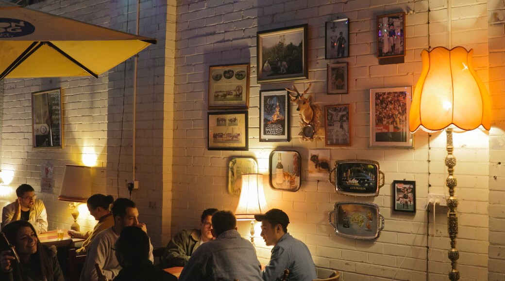 Moon Dog Craft Brewery featuring interior views as well as a small group of people