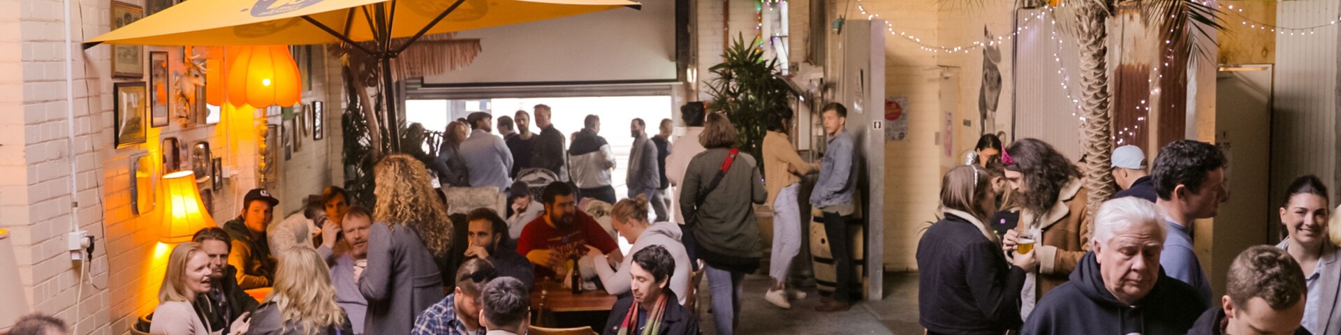 Moon Dog Craft Brewery featuring interior views as well as a small group of people