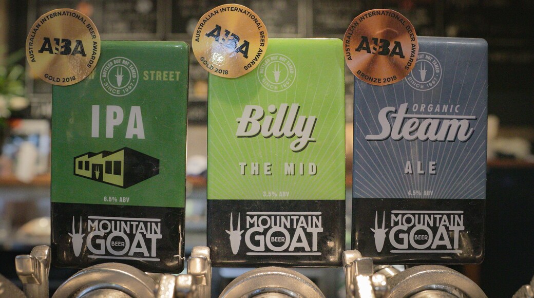 Mountain Goat Beer Brewery featuring signage and a bar