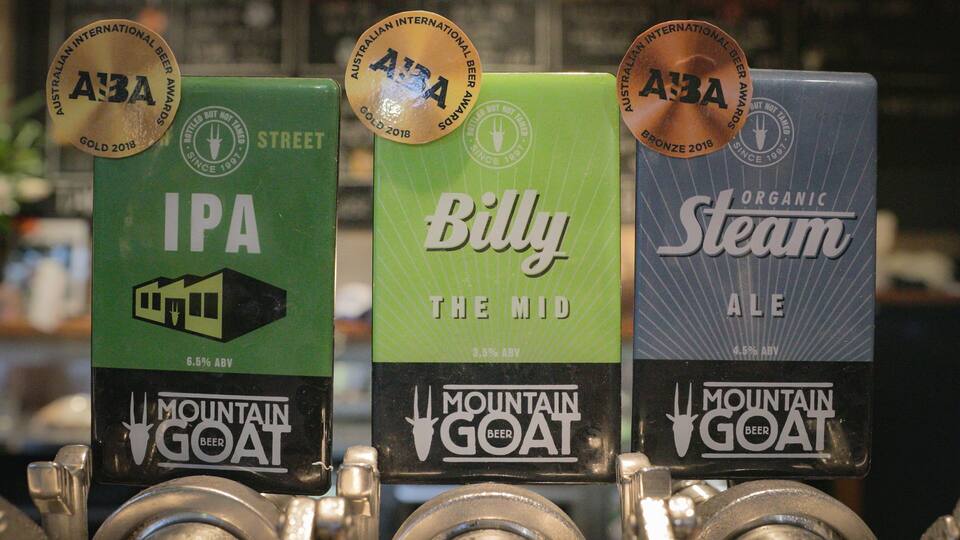 Mountain Goat Beer Brewery featuring signage and a bar