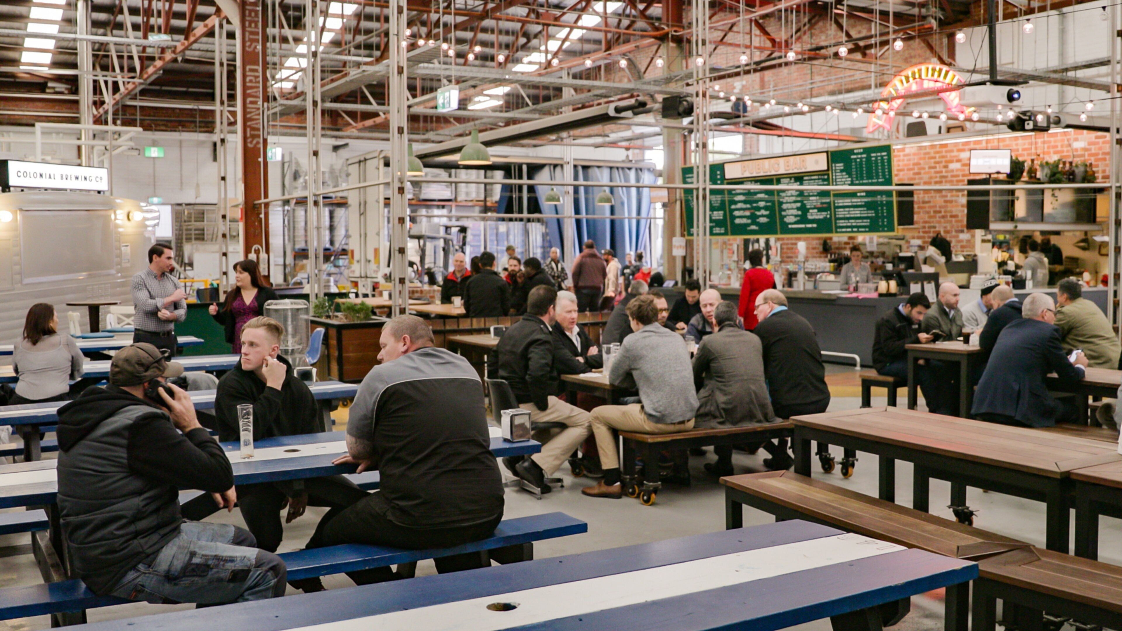 Colonial Brewing Co. featuring interior views and a bar as well as a small group of people