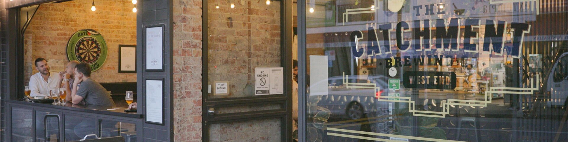 The Catchment Brewing Co. which includes a bar and signage