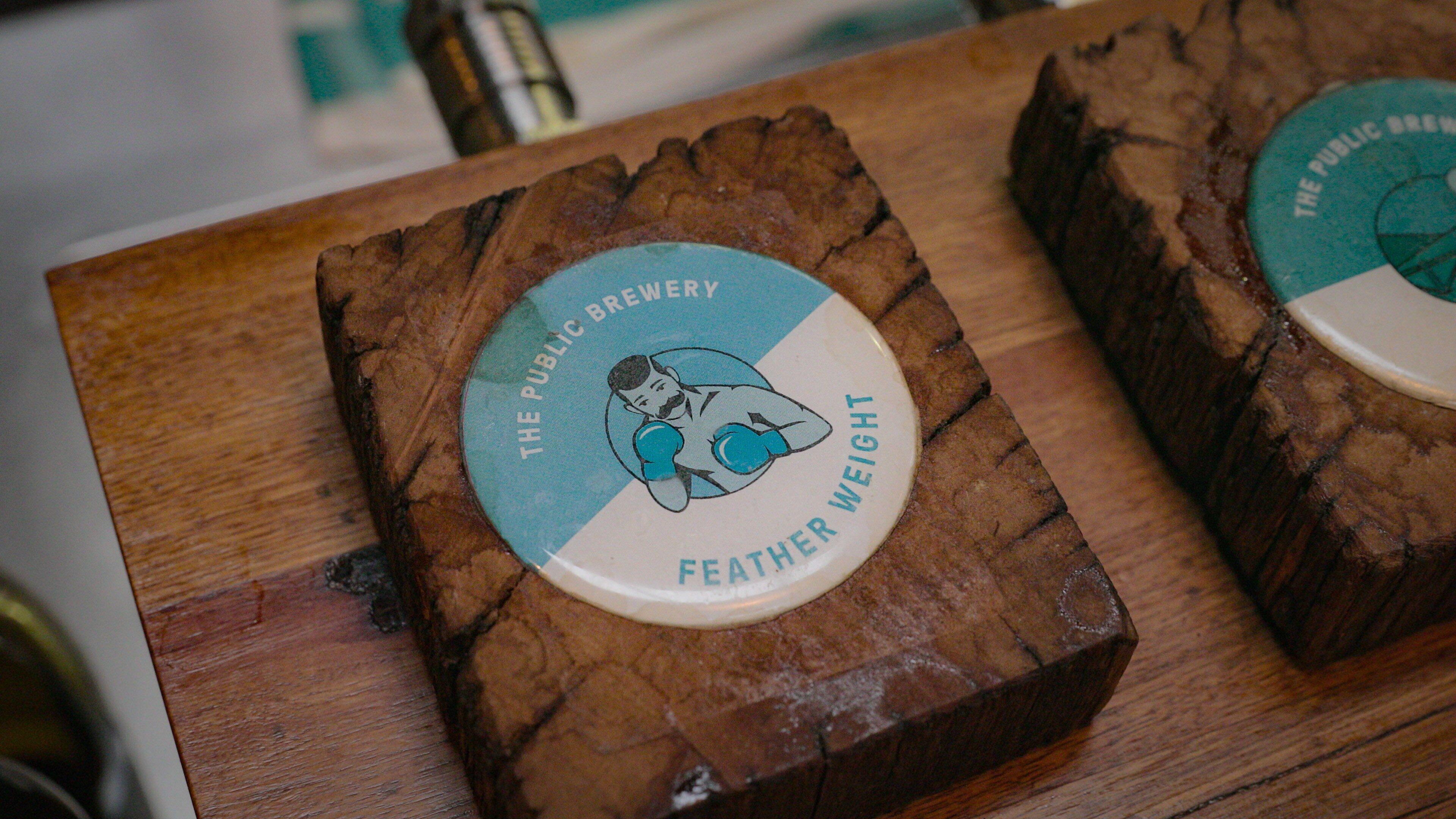 The Public Brewery showing a bar and signage