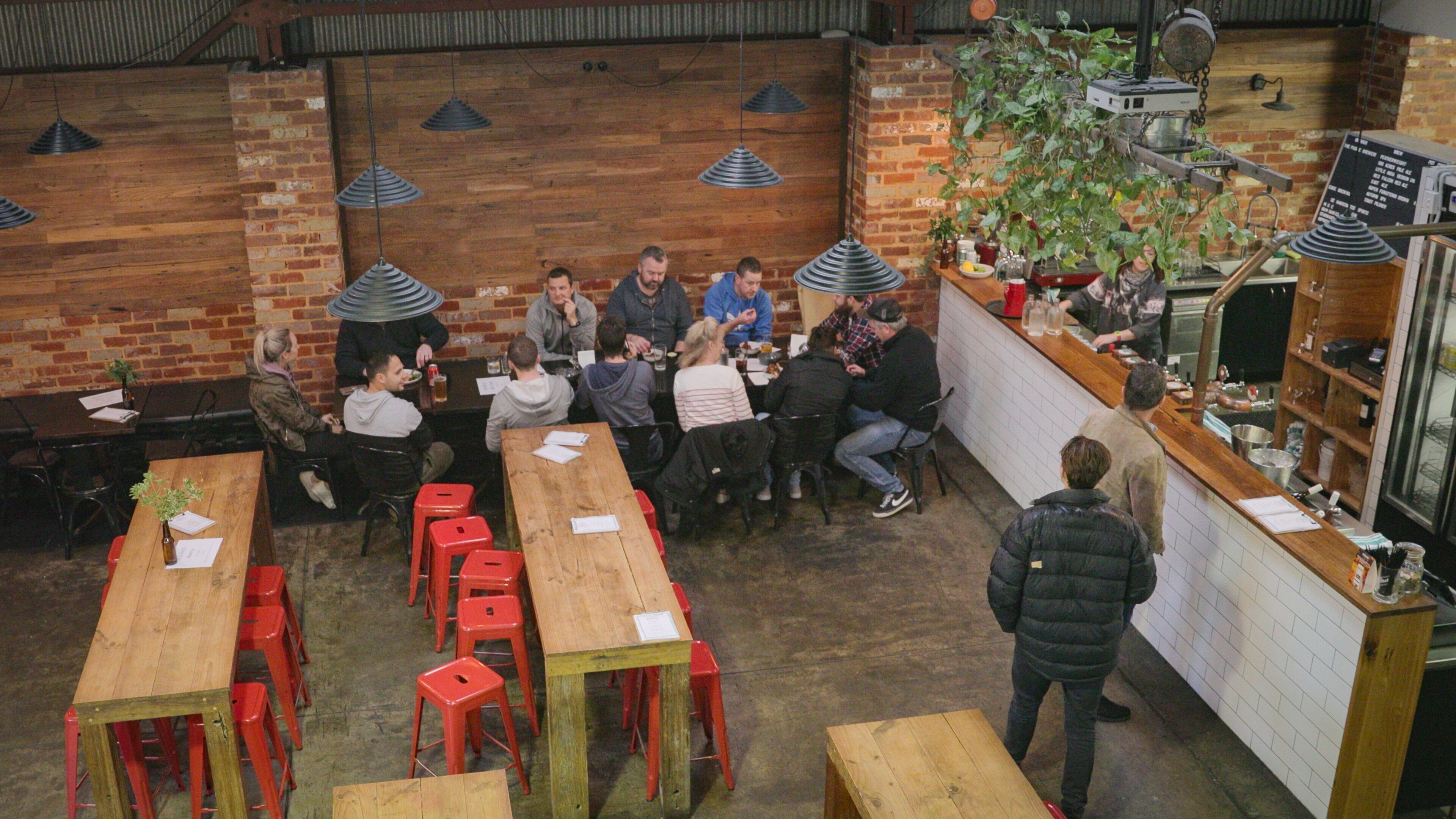 The Public Brewery showing a bar and interior views as well as a small group of people