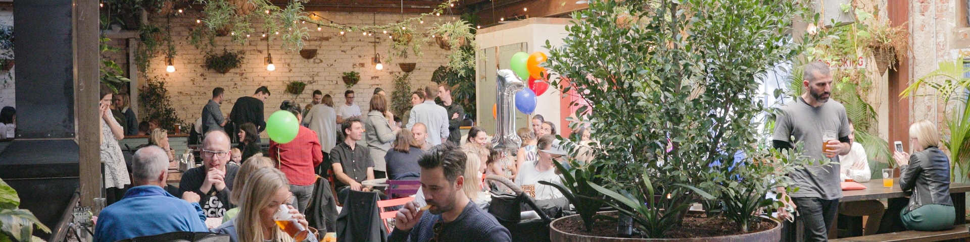 Stomping Ground Brewery showing interior views and cafe lifestyle as well as a small group of people