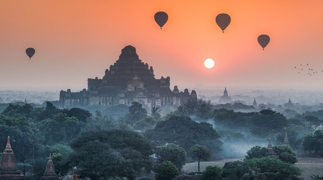 Dhammayangyi Temple and hot air balloons at sunrise, Bagan, Mandalay Region, Myanmar