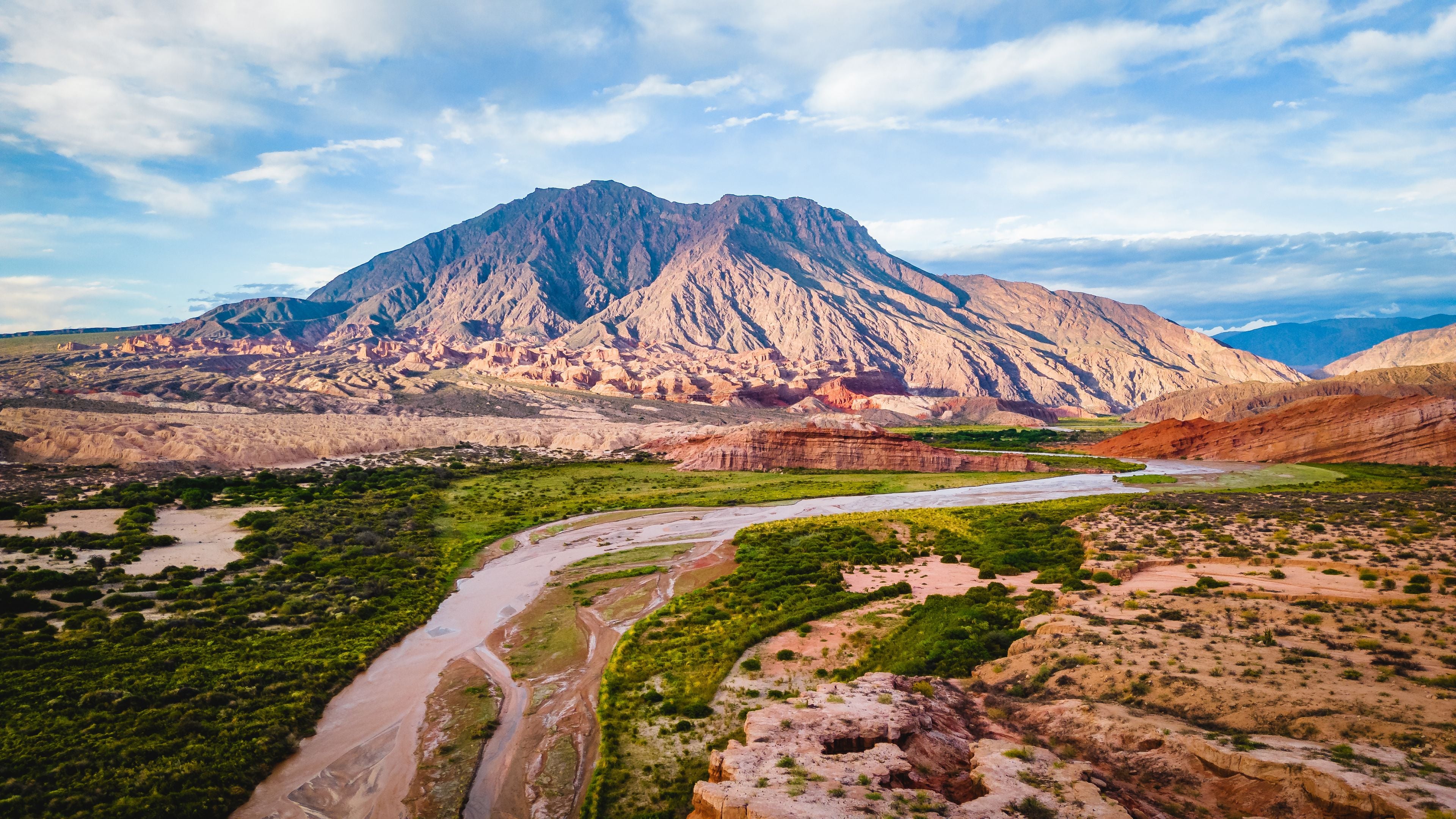 Aerial Drone Above Cafayate Vineyards and Town, Scenic Grape Production Field and Agricultural Village next to Andean Cordillera, Salta, Argentina