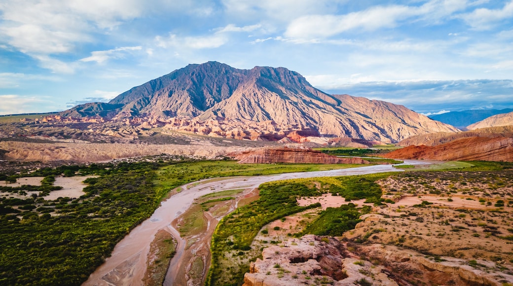 A mountain range with a river flowing through a valley.