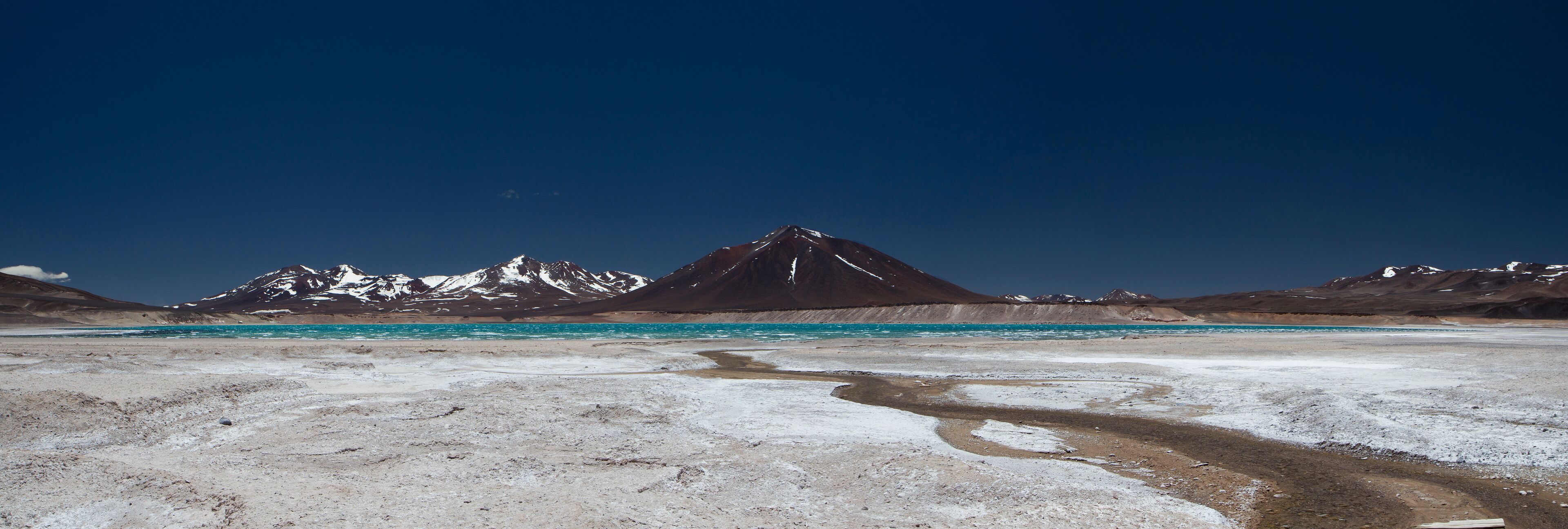 A glacier with a mountain in the background.