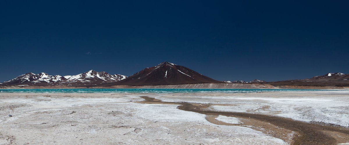 A glacier with a mountain in the background.