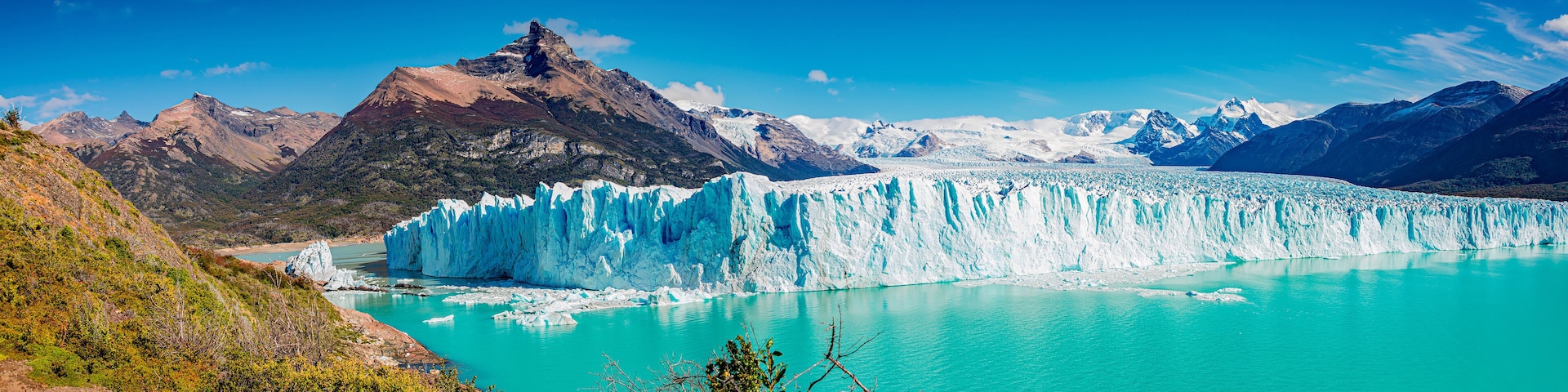 Panoramic view of the gigantic Perito Moreno glacier, its tongue and lagoon in Patagonia in golden Autumn, Argentina