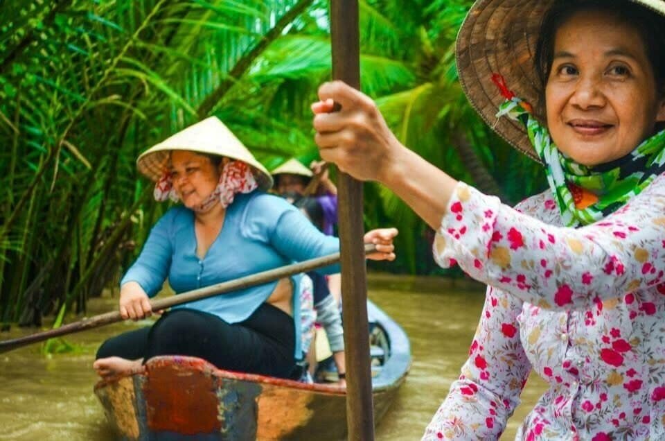 What I discovered: the friendly local women at My Tho province at Mekong Delta, in Viet Nam rowing boats, and their warm motherly smiles