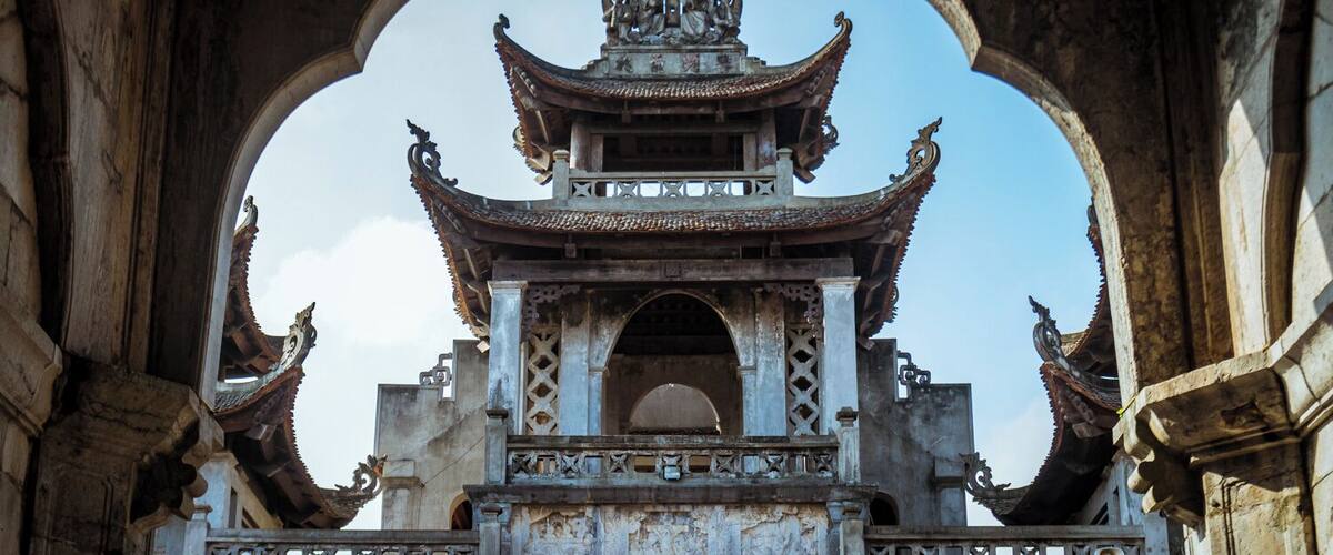 A traditional Chinese temple with ornate architecture, including a multi-tiered roof and intricate carvings.