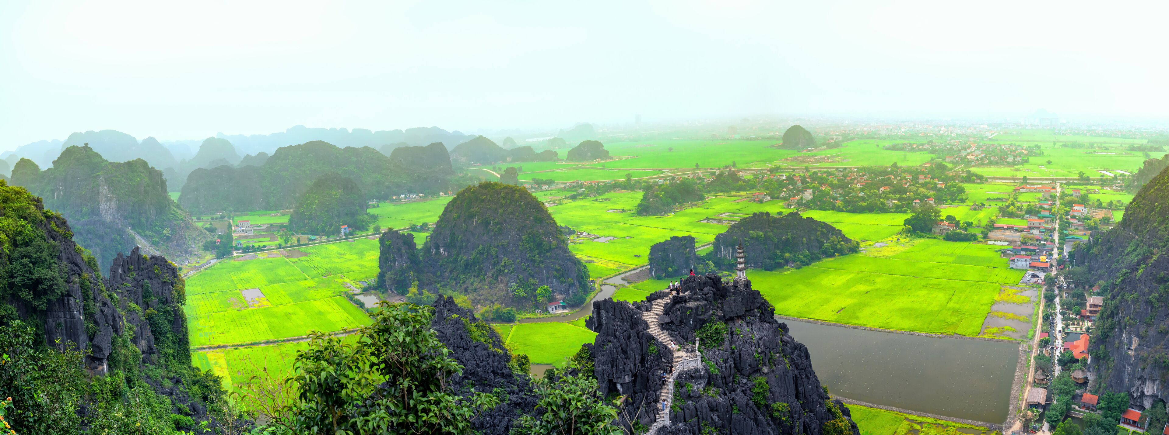 Mua Cave mountain viewpoint looking down valley, Stunning view of Tam Coc area with mountain range, rice fields and river, vietnam landscapes