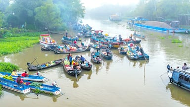 Farmers purchase crowded in Phong Dien floating market morning trade agricultural products serves traditional New Year in Can Tho, Vietnam